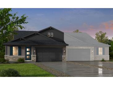 Two-story craftsman home with dark gray siding, stone accents, and a two-car garage at 3441 N Denali St, Aurora, CO 80019