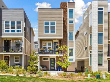 Charming two-story home boasts a modern design with lovely landscaping and a welcoming front porch at 2578 Palau Way, Castle Rock, CO 80109