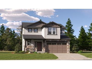 Two-story house with brown accents and a two-car garage at 11053 Snowdon St, Parker, CO 80134