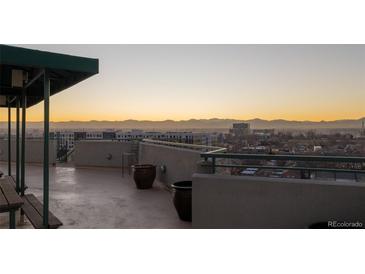 Breathtaking rooftop deck features mountain views, bench seating, and plenty of space for entertaining at 601 W 11Th Ave # 910, Denver, CO 80204