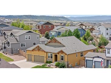 Aerial view of a single-Gathering home in a suburban neighborhood at 3995 Manorbrier Cir, Castle Rock, CO 80104