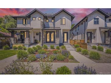 Charming modern home boasts beautiful landscaping, a stone porch, and a delightful exterior design at 2525 S Pearl St, Denver, CO 80210