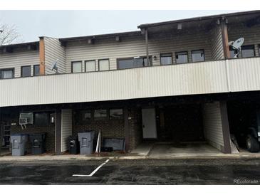 View of the exterior of this townhome showing the carports at 1943 Meadow Dr # B2, Longmont, CO 80501