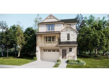 Charming two-story home featuring stone accents, a balcony, and a well-maintained lawn and attached two car garage at 7307 Waterleaf Trl, Littleton, CO 80125