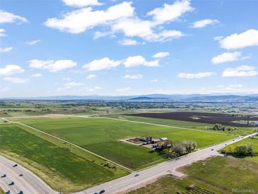 Expansive aerial view of land with a beautiful view of the horizon and large open green field at 1805 W County Road 8, Berthoud, CO 80513