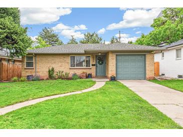 Charming brick home with a well-manicured lawn and inviting curb appeal at 1060 S Harrison St, Denver, CO 80209