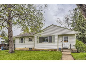 Charming one-story home with green trim, grassy lawn, and a sidewalk leading to the front door at 5370 S Sherman St, Littleton, CO 80121