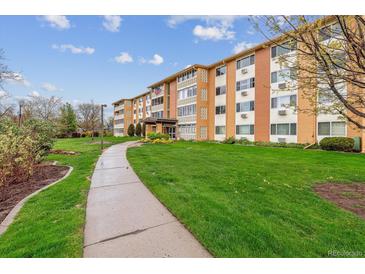 Inviting multi-story condo with charming exterior details and well-maintained landscaping at 795 S Alton Way # 5D, Denver, CO 80247