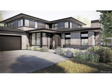 Stunning modern home with a sleek design, beautiful landscaping, and a welcoming entrance at 4852 Isabell Ct, Golden, CO 80403