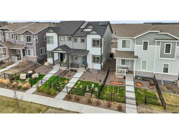 Modern townhomes offer stylish exteriors and landscaped yards, perfect for urban living at 12580 Boggs St, Parker, CO 80134