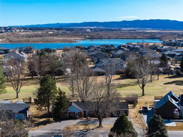 Aerial view highlighting lakeside homes in a well-maintained community with picturesque landscape at 22 Wedge Way, Littleton, CO 80123