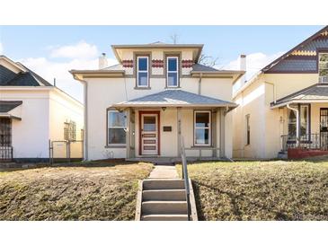 Charming two-story home with a front porch, showcasing its classic architectural style and curb appeal at 4718 W 34Th Ave, Denver, CO 80212