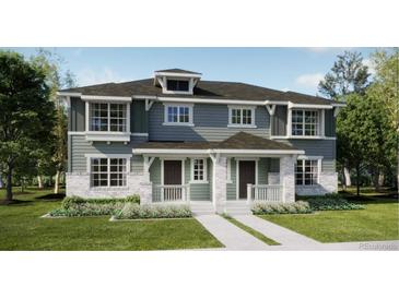 Two-story craftsman style home with gray siding, stone accents, and a front porch at 15242 Detroit St, Thornton, CO 80602