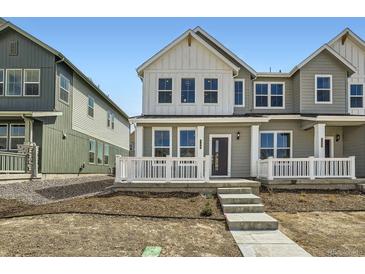 Charming two-story home with a welcoming front porch and a modern design at 708 N Bently St, Watkins, CO 80137