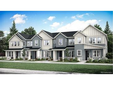 Charming row of newly built townhomes featuring eye-catching exterior design and professionally landscaped yards at 708 N Bently St, Watkins, CO 80137