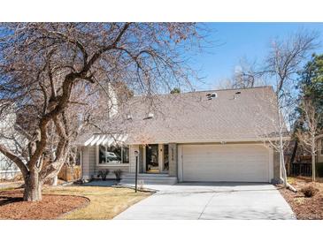 Charming single Gathering home with a two-car garage and inviting front yard at 6368 S Emporia Cir, Englewood, CO 80111