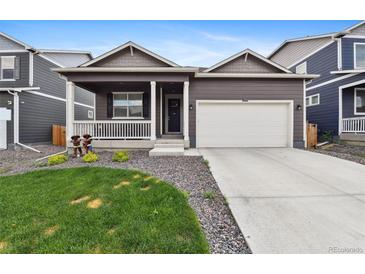 Charming home with a well-maintained front yard and a two-car garage, plus a cozy porch at 2226 Monte Vista St, Fort Lupton, CO 80621