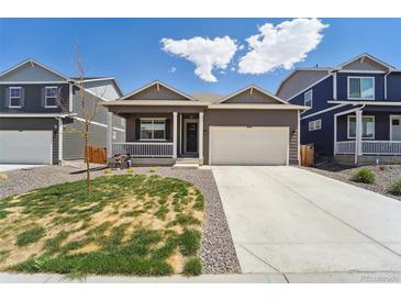 Charming single-story home with a well-manicured lawn and a spacious two-car garage in a suburban neighborhood at 2226 Monte Vista St, Fort Lupton, CO 80621