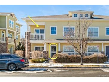 Charming condo featuring a private balcony and well-maintained landscaping at 9489 Ashbury Cir # 202, Parker, CO 80134