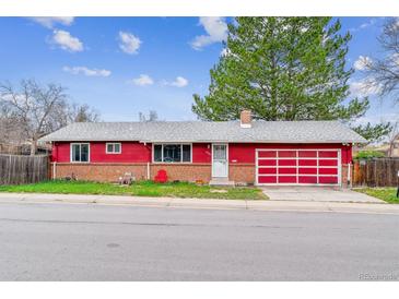 Charming ranch home with red siding, brick accents, and a convenient attached garage at 16588 E 8Th Ave, Aurora, CO 80011
