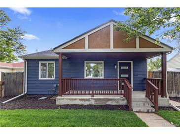 Charming blue home featuring a covered front porch with brown railings and a well-maintained lawn at 1238 Rosemary St, Denver, CO 80220