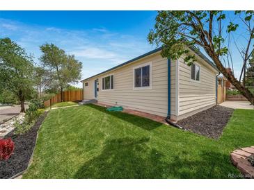 Charming home featuring a well-maintained lawn and classic architecture at 4640 W Ellsworth Ave, Denver, CO 80219