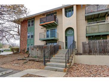 Multi-story building with patios, stone stairs and a neutral color palette at 12180 Melody Dr # 203, Westminster, CO 80234