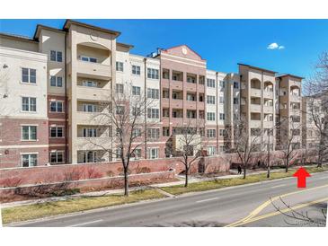 Modern apartment building exterior featuring balconies, brick accents, and a well-maintained landscape at 2200 S University Blvd # 105, Denver, CO 80210