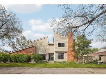 Charming two-story home with brick chimney, well-maintained landscaping and an inviting facade at 7925 W Layton Ave # 500, Littleton, CO 80123