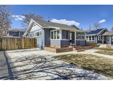 A beautiful property featuring a well-maintained yard and a long driveway at 4441 N Meade St, Denver, CO 80211