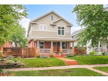 Charming two-story home with a welcoming front porch and well-maintained lawn at 3864 Osceola St, Denver, CO 80212