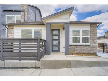 Stylish modern home featuring mixed materials and a well-defined entryway for a contemporary look at 2491 W 69Th Pl, Denver, CO 80221