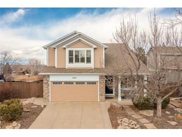 Charming two-story home featuring a two-car garage and well-maintained front yard in a suburban neighborhood at 3001 White Oak Trl, Highlands Ranch, CO 80129