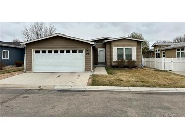 Charming single-story home with attached two-car garage and well-kept front yard at 7811 St Vrain Dr # 68, Frederick, CO 80530