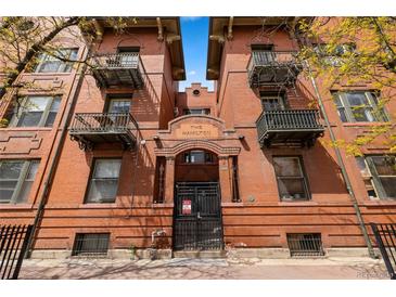 Attractive brick apartment building with wrought iron balconies, and secure gated entry at 1475 N Humboldt St # 20, Denver, CO 80218
