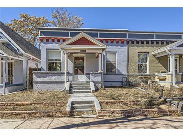 Charming single-Gathering home with a brick-lined front yard, blue paint, and a covered entryway at 1157 N Downing St, Denver, CO 80218