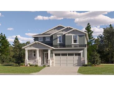 Two-story craftsman style home with gray siding, stone accents, and a two-car garage at 24736 E Evans Dr, Aurora, CO 80018