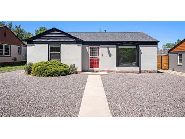 Charming single-story home with a red front door, grey exterior, and manicured gravel yard at 1355 Rosemary St, Denver, CO 80220