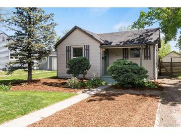 Charming single-Gathering home featuring a well-maintained front yard with mature landscaping and inviting curb appeal at 4712 Perry St, Denver, CO 80212