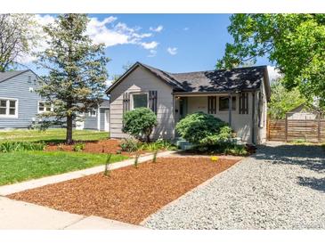 Charming single-story home with landscaped front yard and gravel driveway at 4712 Perry St, Denver, CO 80212