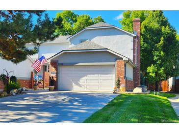 Two-story home with attached garage and landscaped yard at 5109 S Emporia Way, Greenwood Village, CO 80111