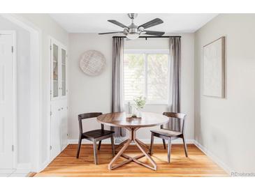 Charming dining space with modern lighting, built-in cabinet, and cozy seating at 5190 E Asbury Ave, Denver, CO 80222