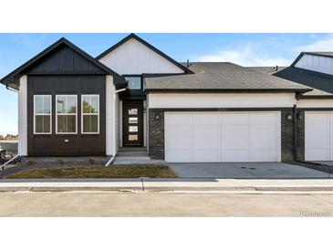 Charming modern two-story home with a two-car garage and sleek architectural details at 8242 S Pierson St, Littleton, CO 80127