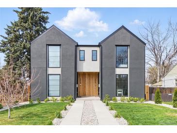 Stunning modern home featuring a gray exterior, natural wood accents, large windows, and professional landscaping at 2961 S Cherokee, Englewood, CO 80110