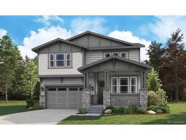 Charming two-story home featuring craftsman-style architecture with a covered porch and professionally landscaped yard at 8259 Rockvale Dr, Littleton, CO 80125