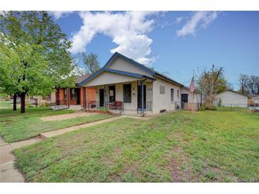 Charming single-Gathering home with a well-manicured lawn and classic architectural details at 4514 Bryant St, Denver, CO 80211