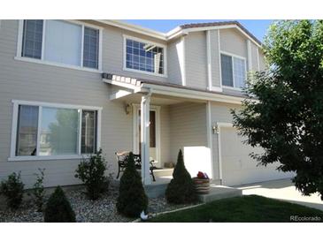 Charming two-story home with well-maintained lawn and inviting front porch at 10272 Fawnbrook Ct, Highlands Ranch, CO 80130
