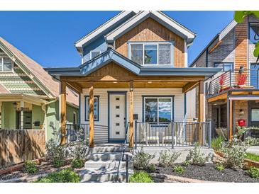 Charming two-story home featuring a welcoming front porch, stylish accents, and well-maintained landscaping at 3640 Lipan St, Denver, CO 80211