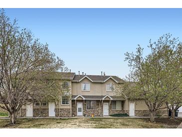 Inviting townhomes with stone accents and mature trees in a well maintained community at 2139 Coronado Pkwy # B, Denver, CO 80229