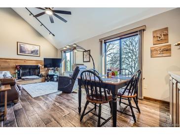Bright dining area features wood floors, a large window and seating for four, creating a cozy atmosphere at 6504 Ralston Rd # A, Arvada, CO 80002